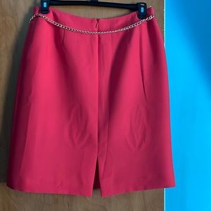Tahari Salmon color skirt with Gold chain belt.